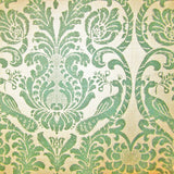 Detail of fabric in a botanical and bird print in dark turquoise on a cream field.