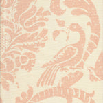 Detail of fabric in a botanical and bird print in light pink on a cream field.