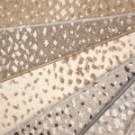 Broadloom carpet with subtle animal print in a range of colors. 
