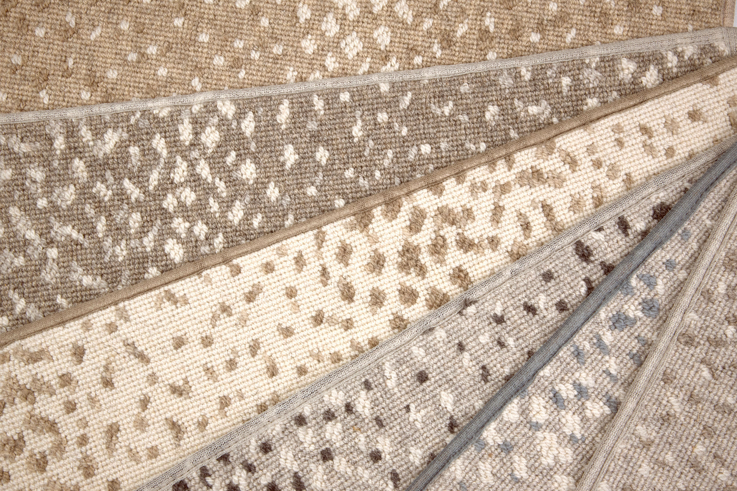 Broadloom carpet with subtle animal print in a range of colors. 