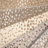 Broadloom carpet with subtle animal print in a range of colors. 