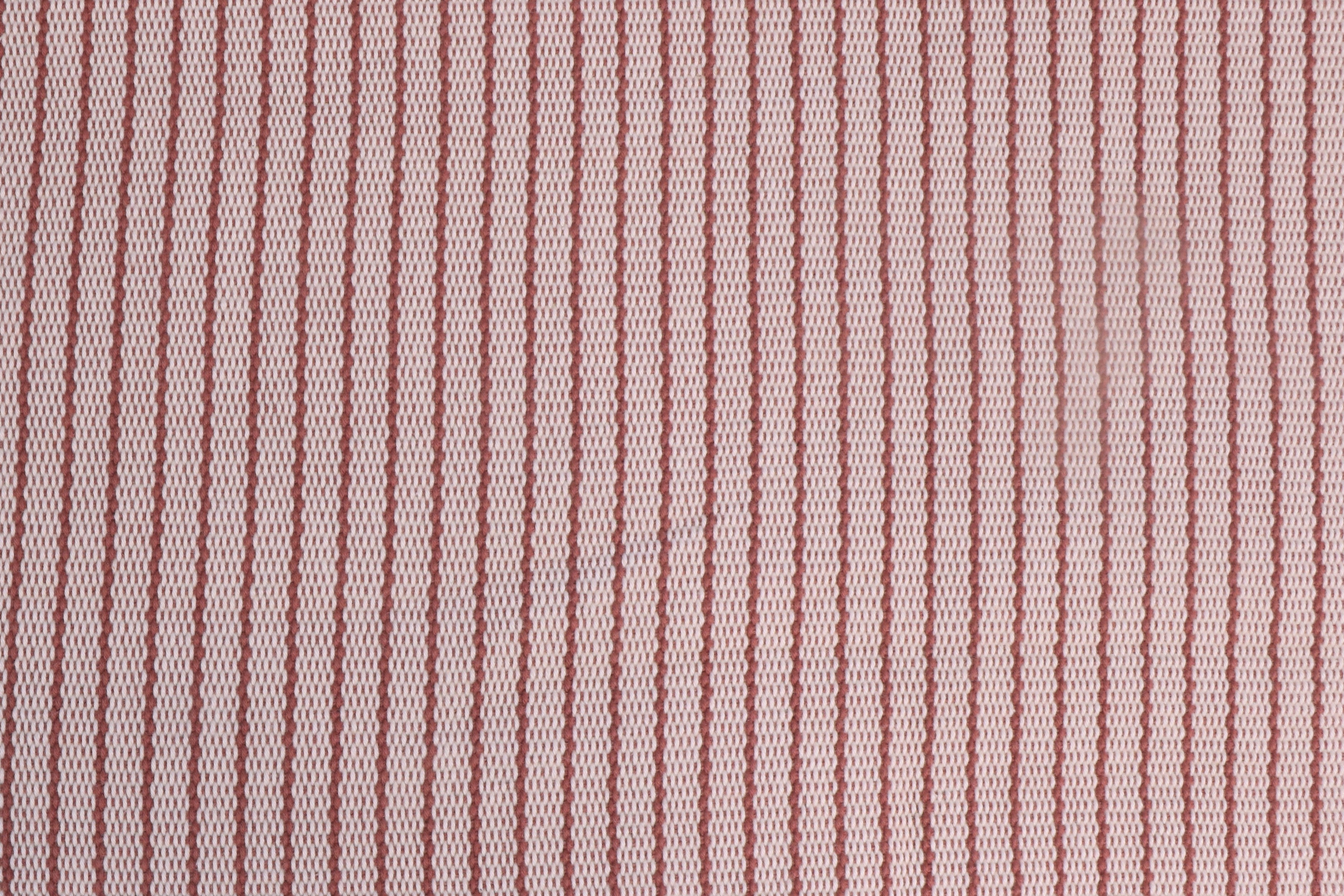 Handwoven fabric with  rust red and white stripes