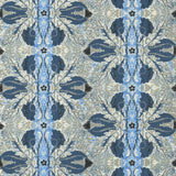 Detail of wallpaper in a textural botanical print in shades of navy, blue and cream on a tan field.