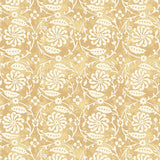 Wallpaper with white floral and leaf design on a yellow background