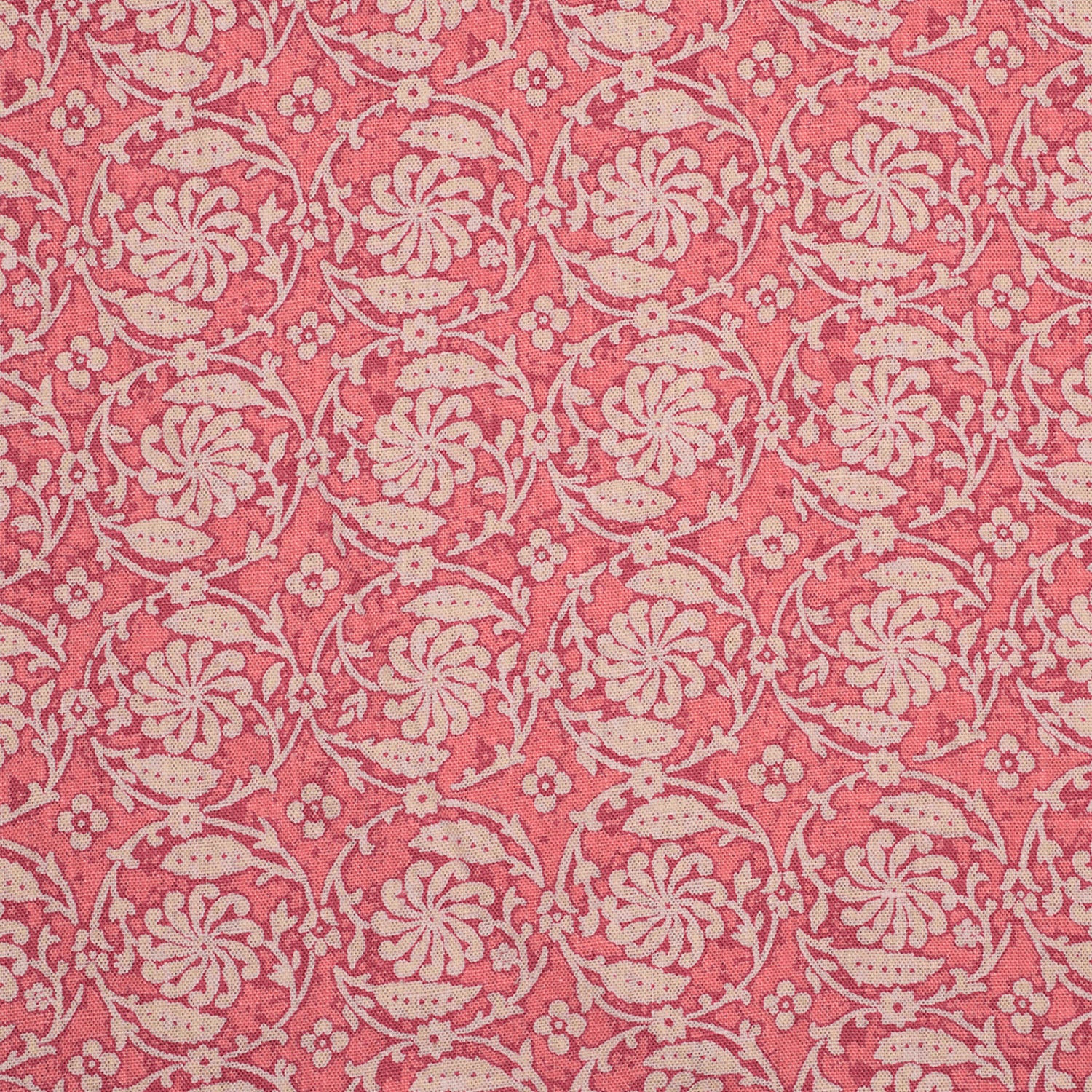 Patterned fabric with floral & vine design on a pink background