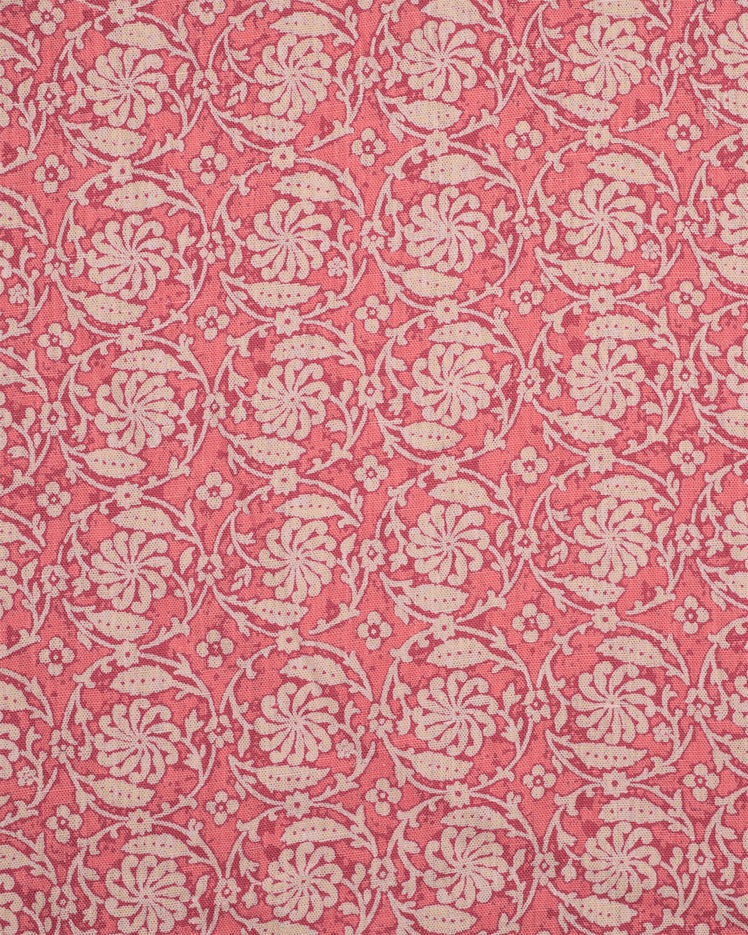 Patterned fabric with floral & vine design on a pink background