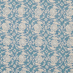 Patterned fabric with floral & vine design on a  blue background