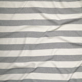 Close up of gently draped woven Indoor-Outdoor fabric with wide stripes in white and charcoal grey.