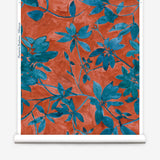 Wallpaper roll with blue leaf pattern on a red background