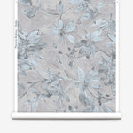 Wallpaper roll with floral pattern on a light gray background