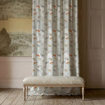 Decorative bench in front of a curtain with a patterned wall and door in the background