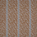 Printed fabric detail in a geometric rhythmic stripe in warm brown with a light blue accent
