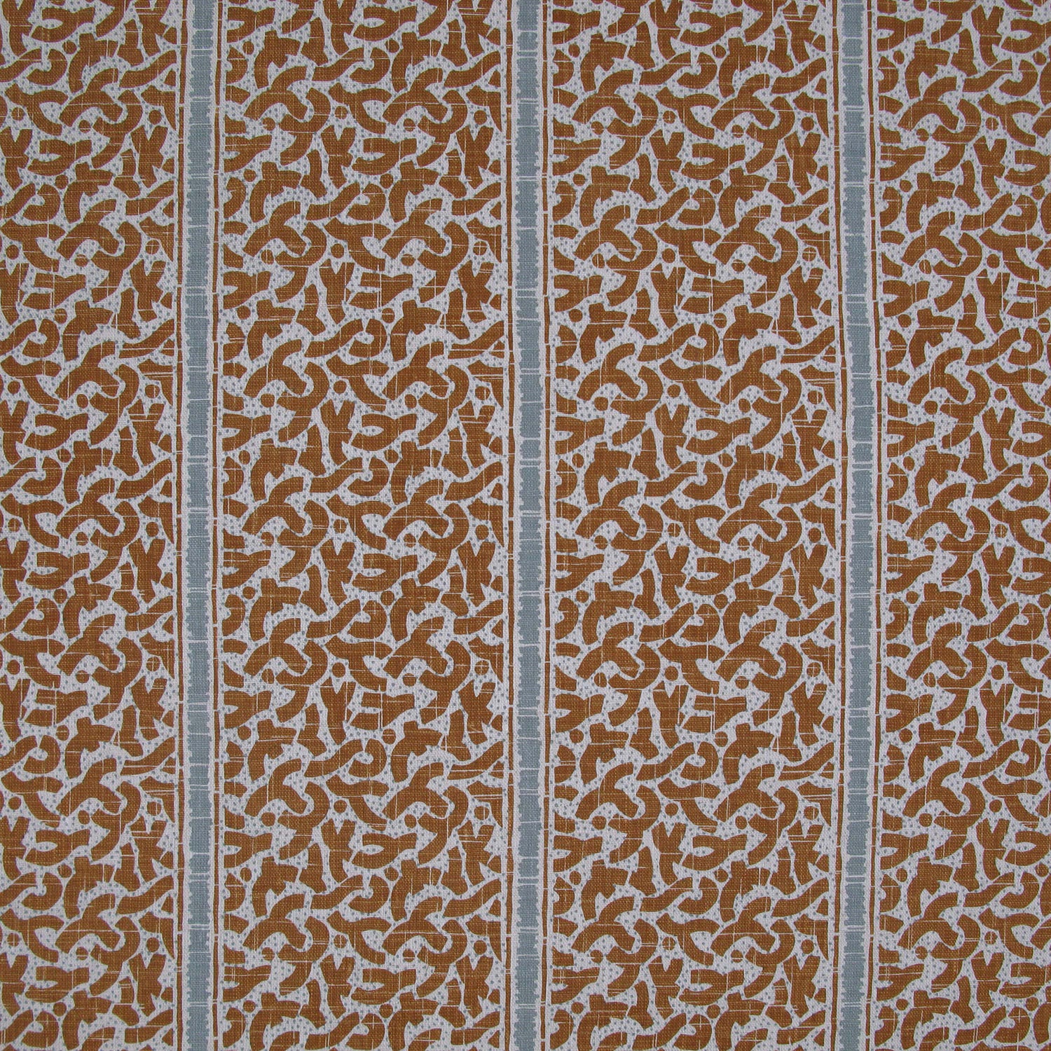 Printed fabric detail in a geometric rhythmic stripe in warm brown with a light blue accent
