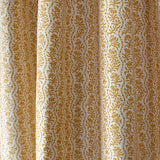Drapped printed linen in a wavy floral stripe design in yellow on cream.