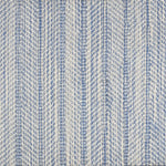 Broadloom carpet in a striated herringbone stripe in cream and bright blue.