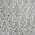 Broadloom carpet in a dimension diamond lattice in cream and grey-green