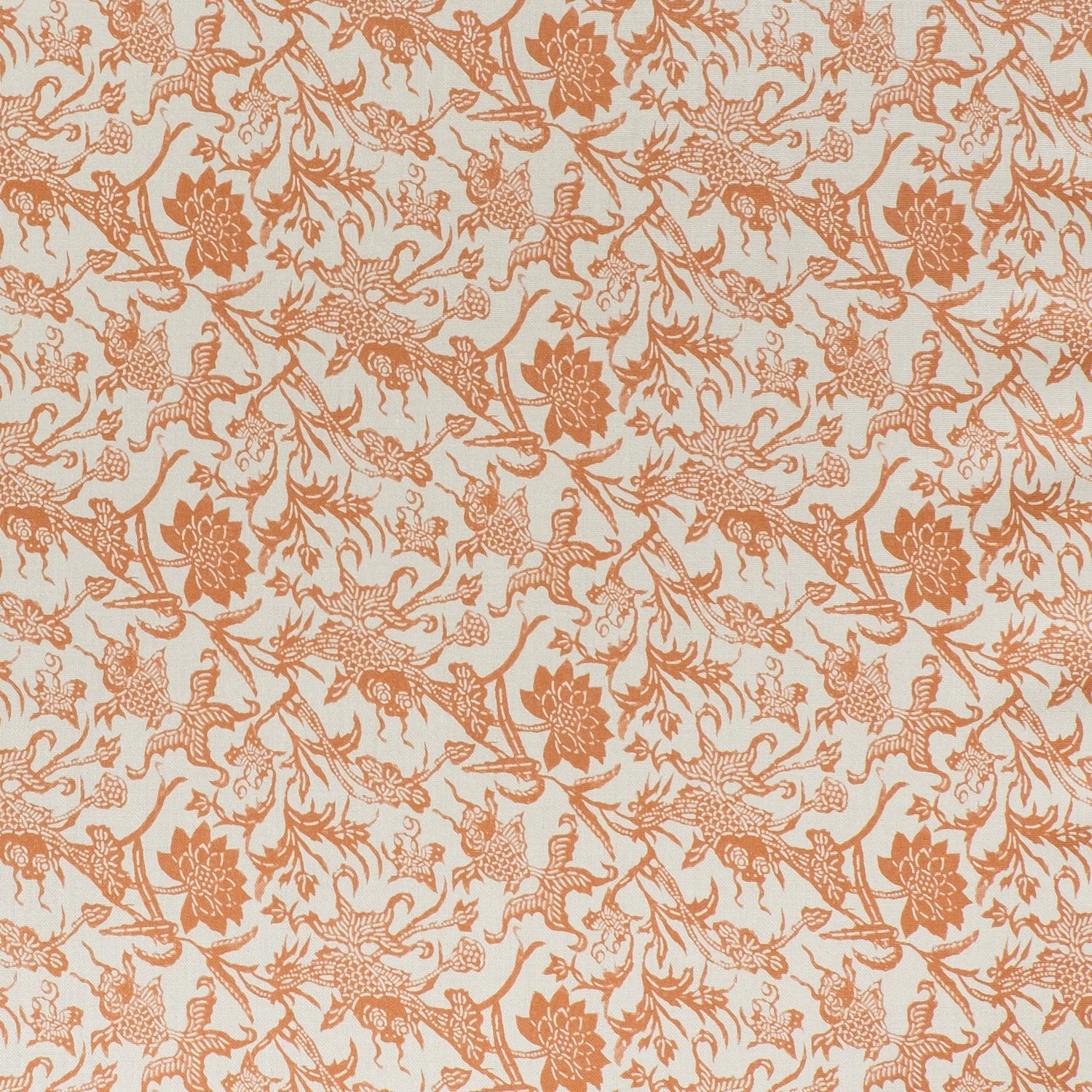 printed linen fabric in a carp and leaf pattern in orange on a beige field.
