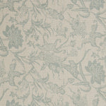 Detail of a linen fabric in a carp and leaf pattern in misty blue on a beige field.