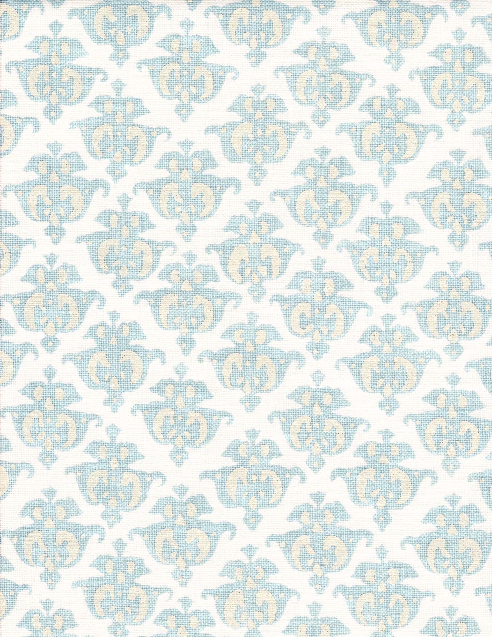Detail of fabric in a repeating damask print in blue and yellow on a white field.