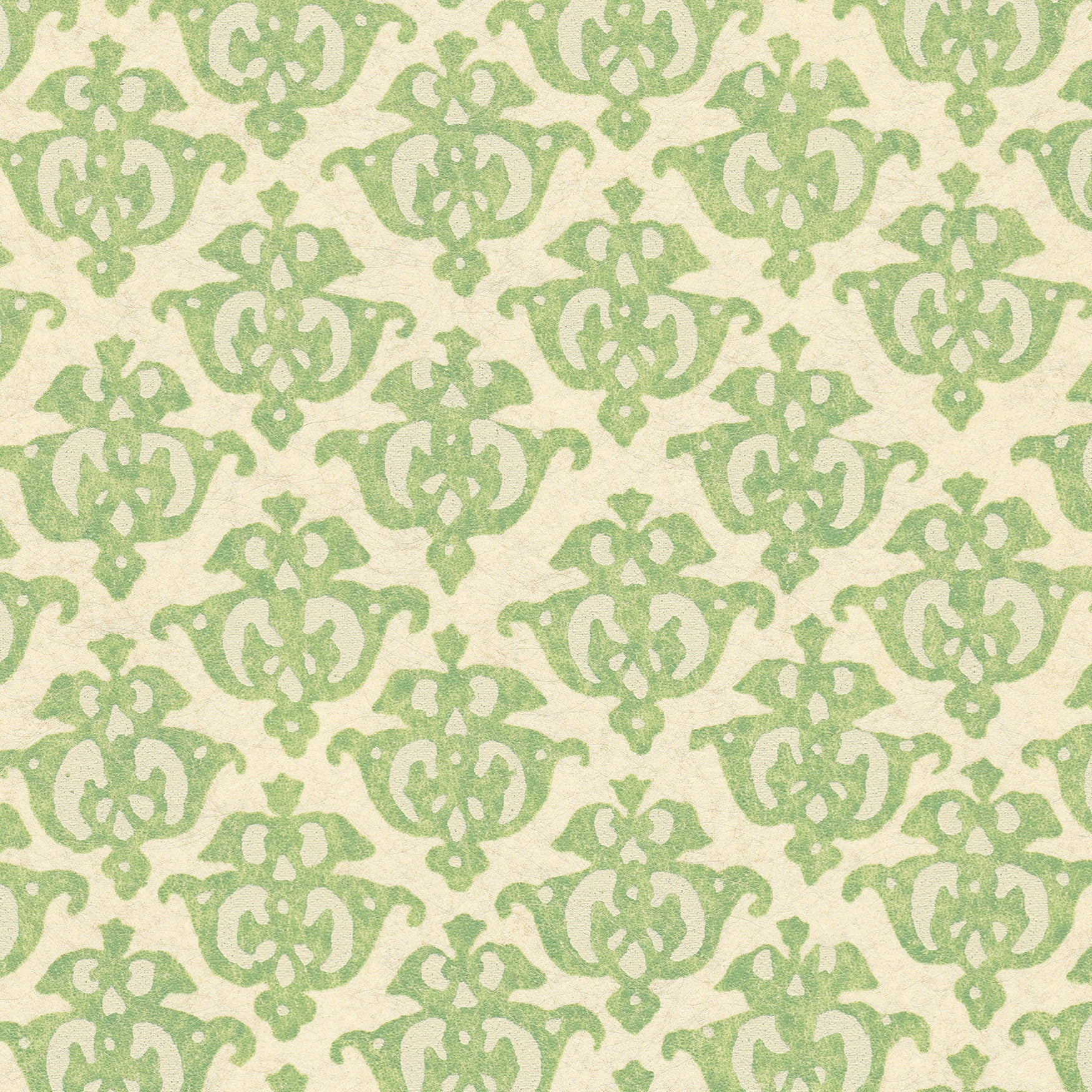 Detail of wallpaper in a repeating damask print in green on a cream field.