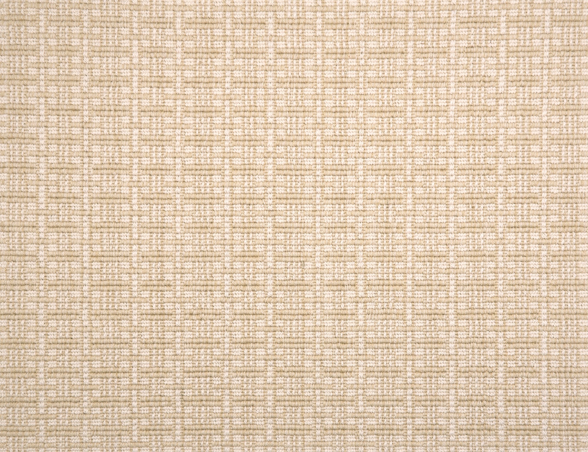 A close-up of broadloom carpet with a textured basketweave pattern in warm cream and beige.