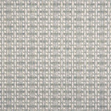 A close-up of broadloom carpet with a textured basketweave pattern in warm cream and sky blue.