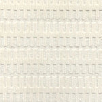A close-up of a broadloom rug in a vertical ribbed pattern  in off-white.