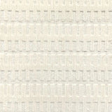 A close-up of a broadloom rug in a vertical ribbed pattern  in off-white.