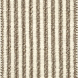 Textured area rug with vertical striped pattern on a neutral background
