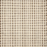 Close-up of a textured handmade rug with a grid pattern in beige and brown.