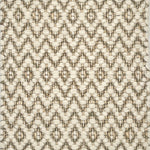 Textured flatweave rug with a diamond pattern in beige and brown tones.