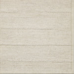 Close-up of a textured broadloom carpet with horizontal lines