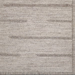 Textured rug with horizontal stripes in neutral colors