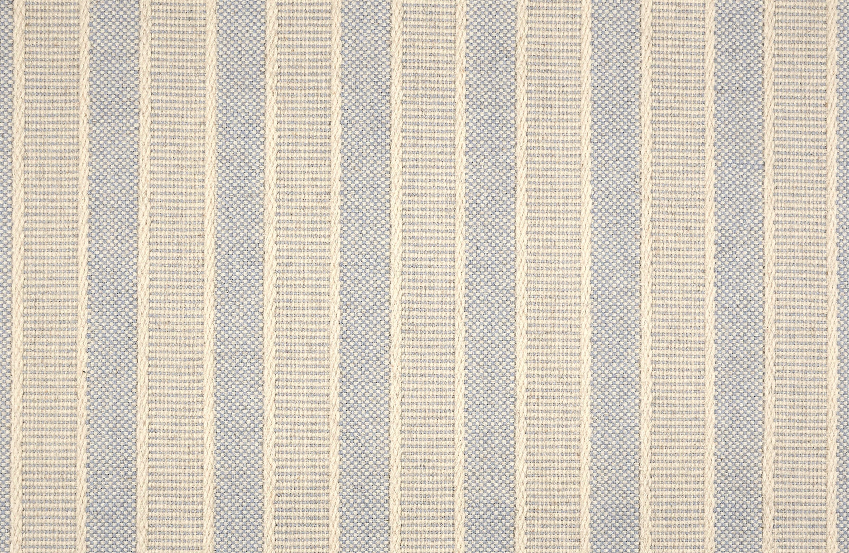 Broadloom carpet in cream and blue stripes.