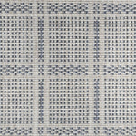 Broadloom carpet in check pattern in shades of blue with cream. 