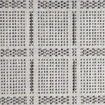 Broadloom carpet in check pattern in shades of brown and blue with cream. 