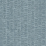 Detail of wallpaper in a small-scale checked pattern in shades of blue.