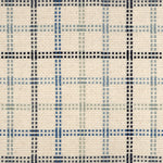 Broadloom carpet in a dashed window pane plaid in shades of blue on a cream field.