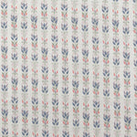 Detail of fabric in a striped botanical print in shades of blue, pink, purple and green on a greige field.