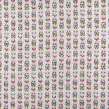 Detail of fabric in a striped botanical print in shades of red, purple and green on a cream field.