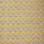 Fabric with a tan and navy blue geometric pattern.