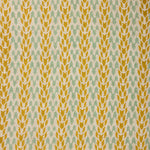 Textile pattern with yellow and green design on a fabric background