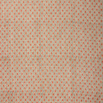 Textile pattern with small diamond shapes in red on a beige background