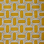 Close-up of fabric with geometric mosaic pattern in yellow and blue