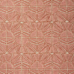 Fabric with geometric sun pattern in clay pink and rust red.