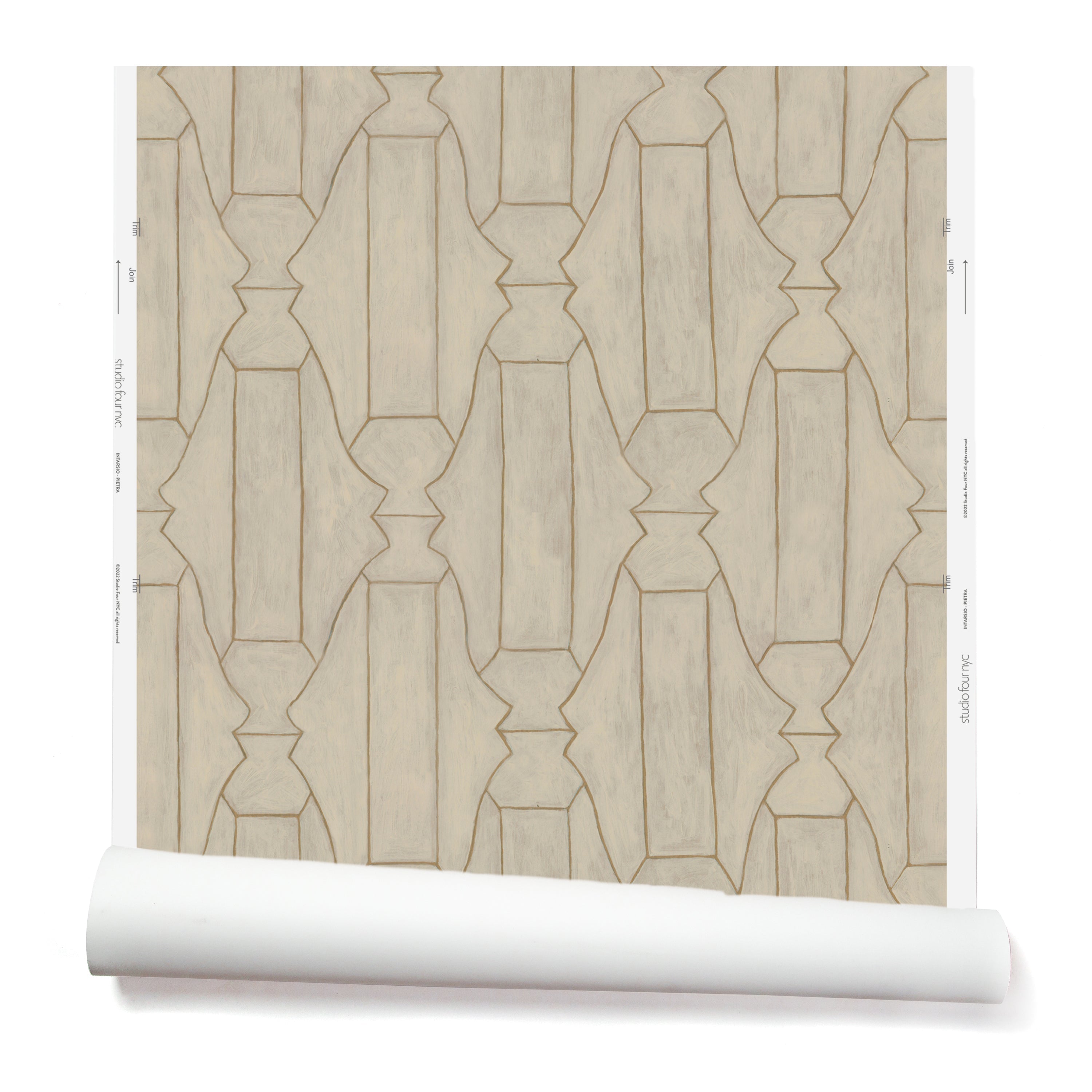 Partially unrolled wallpaper in a repeating curvolinear print in gold on a painted cream field.