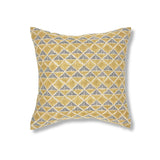 Block printed pillow with tan diamonds and navy cross hatched lines.
