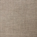 A swatch of linen fabric in a small-scale dotted pattern in tan and dark brown.