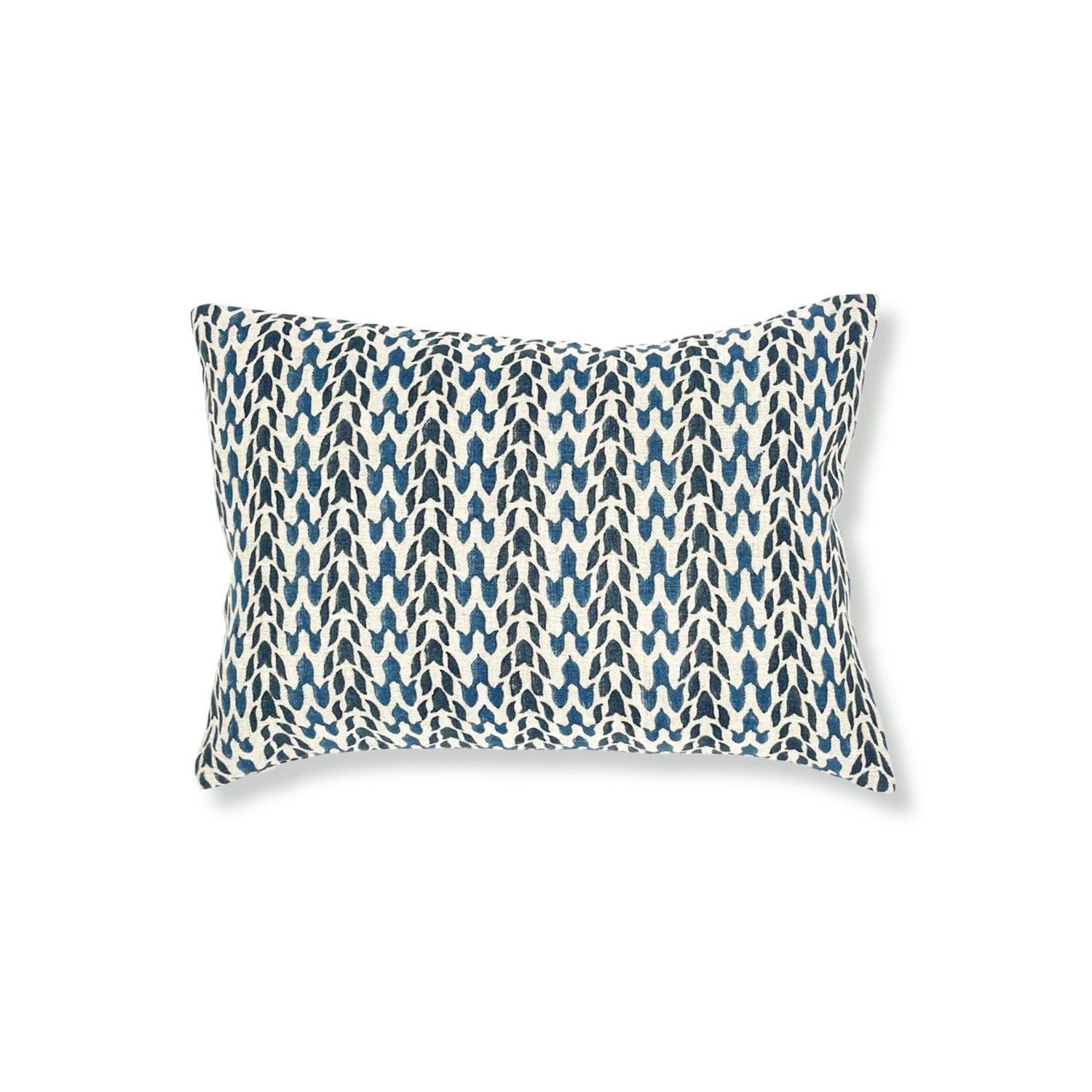 Block printed lumbar pillow with organic petal pattern in shades of blue. 