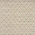 Detail of a handowven rug in an diamond like pattern in white and soft pink.